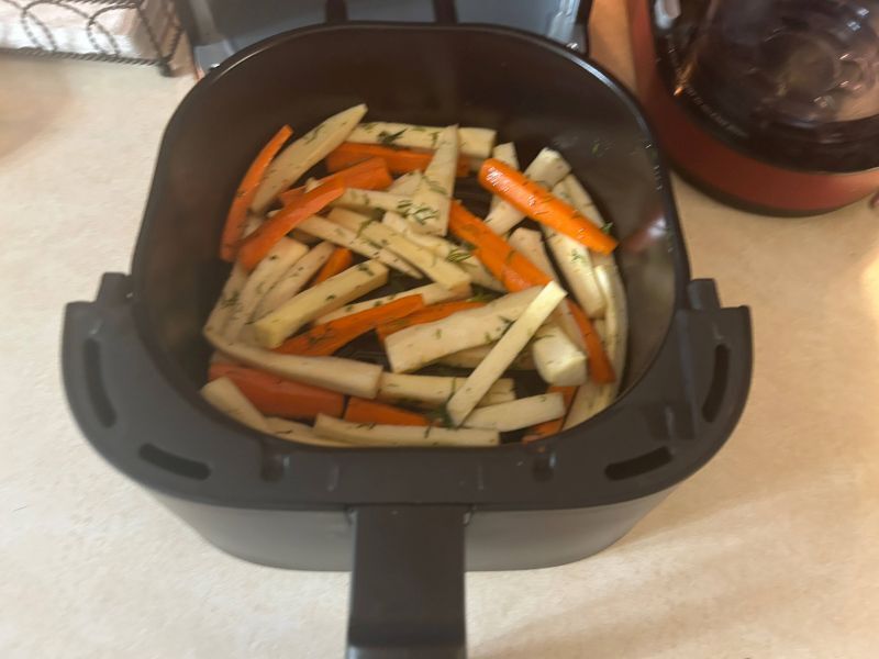 Crispy air-fried root vegetables seasoned with dill served as a side dish