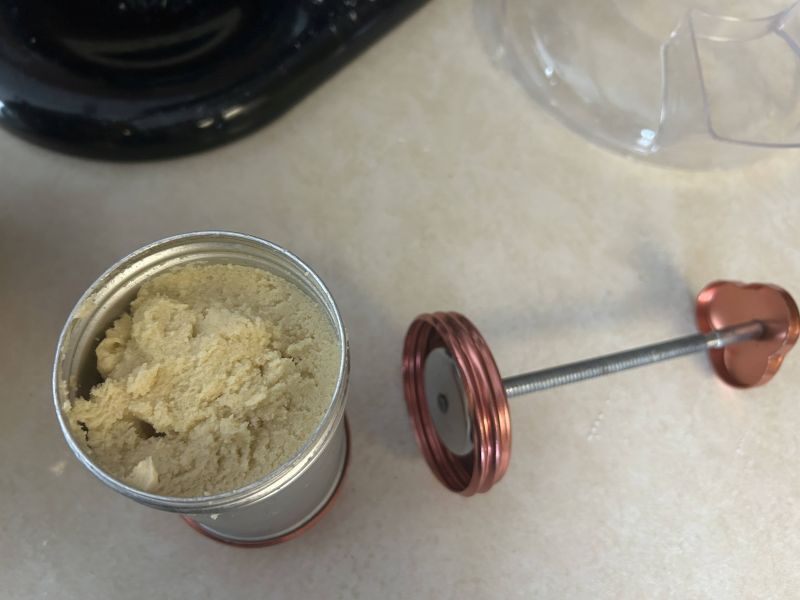 Cookie press filled with almond dough