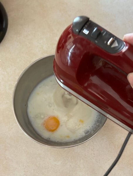 Swedish Almond Cake Step 1: Mix sugar, egg, milk and almond extract.