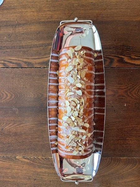 Swedish Almond Cake Step 10: Drizzle with almond glaze and top with sliced almonds and serve!