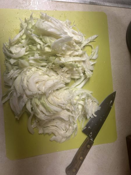 Sliced and boiled cabbage for Kålstuing, a Norwegian creamed cabbage side dish