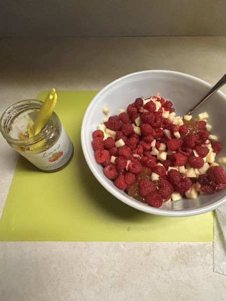 Mixing cloudberry preserves and lemon juice