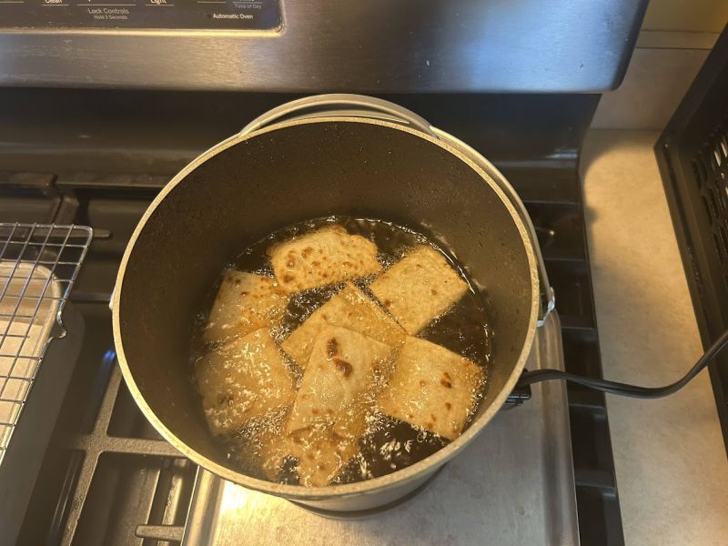 Deep frying lefse chips in a Fry Daddy in Rushford, MN