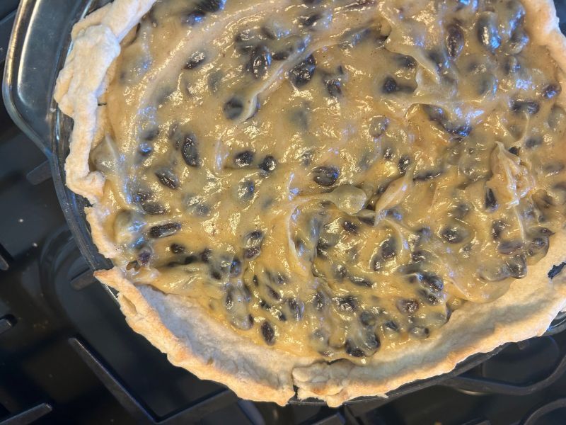 Thickened sour cream raisin filling added to a pre-baked pie shell