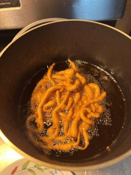 Second side of funnel cake frying