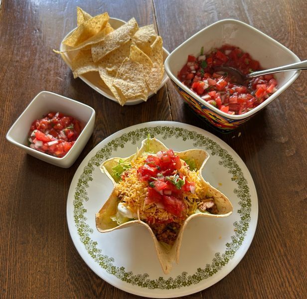Garden fresh salsa with chicken taco salad in tortilla bowls