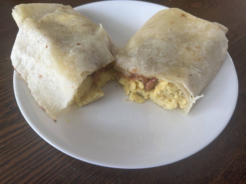 Finished Gjetost breakfast wrap with lefse, cut and served on a plate