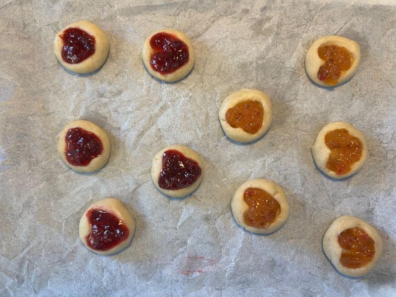 Pressing heart shapes into cookies
