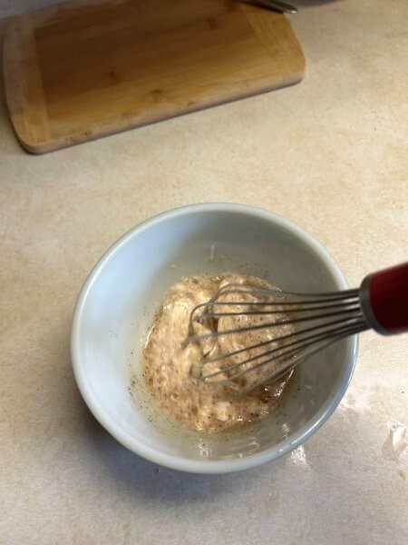 Mixing up the sauce for the herring potato salad.