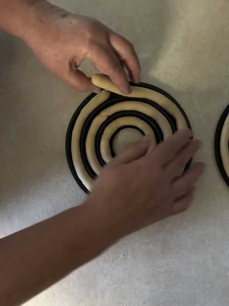 Filling kransekake ring pans with dough