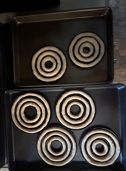 Placing kransekake pans on large baking sheets