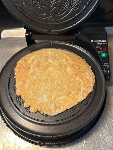 Baked krumkake on iron