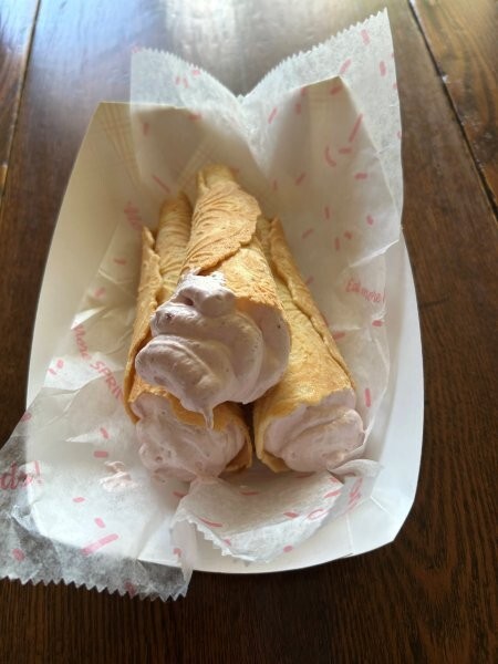 Finished krumkake with lingonberry whipped cream