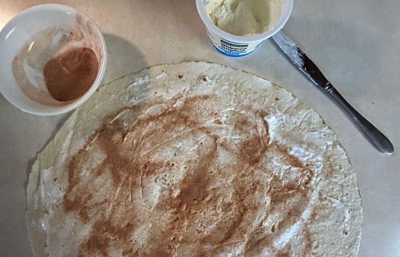 Spread whipped cream cheese and cinnamon sugar on a round of lefse