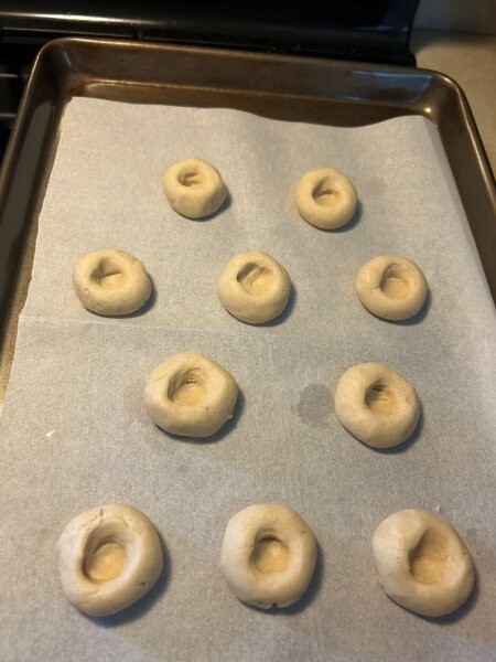 Formed thumbprint cookies ready for adding the preserves.