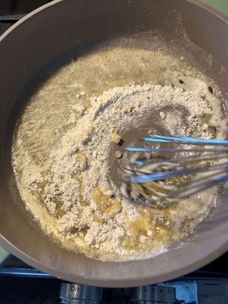 Whisking butter and flour in skillet to start gravy