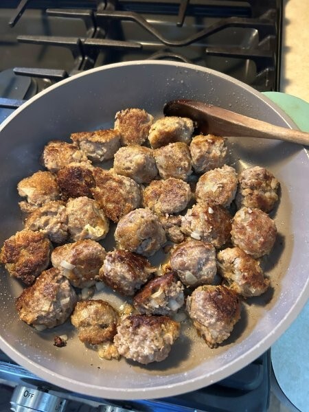 Close-up of finishing the frying process for meatballs