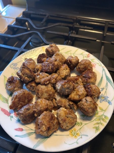 Cooked meatballs on a plate, ready for gravy