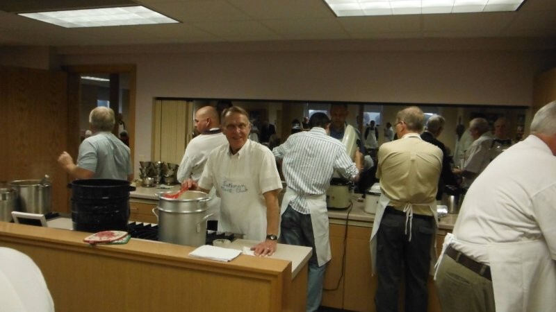 Men’s Club working in the kitchen, Marvin Bestul facing camera