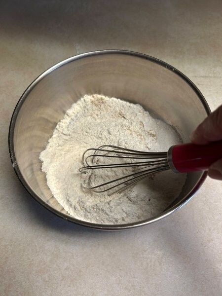 Dry ingredients being whisked for donut batter
