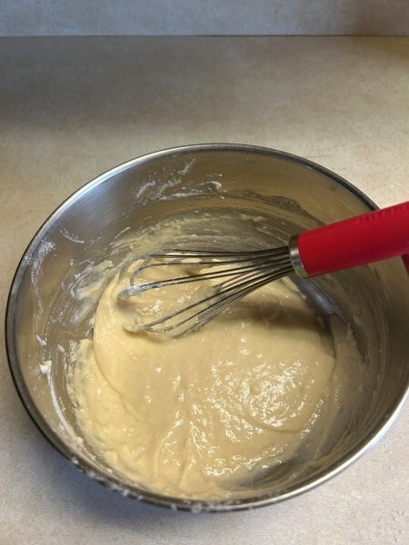 Funnel cake batter being whisked together