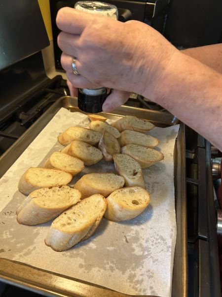 Toasted baguette slices sprinkled with sea salt