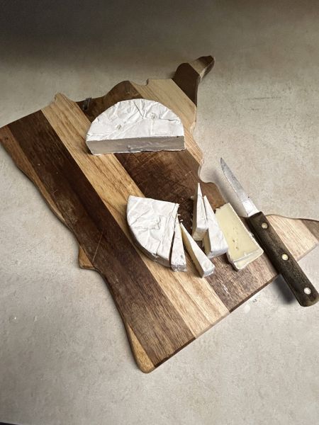 Cutting Brie cheese for bruschetta