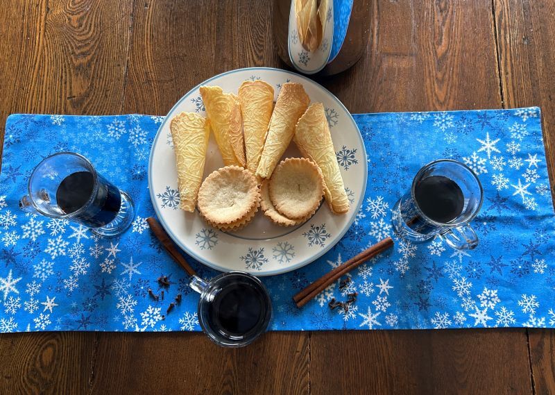Traditional Norwegian Gl&ouml;gg served with sandbakkels and krumkake for a holiday afternoon treat
