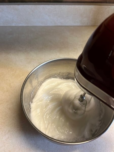 Beat three egg whites in a separate bowl.