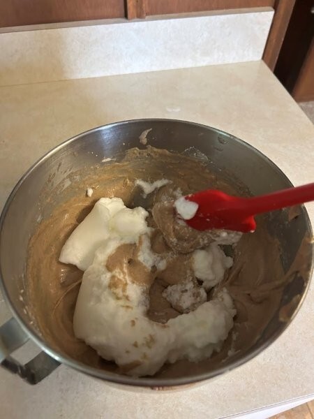 Fold egg whites into the batter.