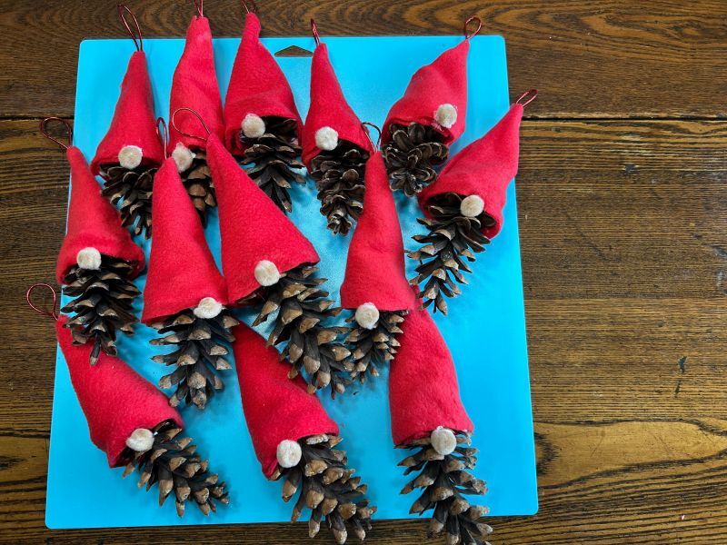 Finished Norwegian-style pinecone gnome ornaments ready for the Christmas tree.