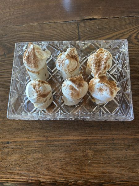Pumpkin lefse rolls served on a plate for dessert.