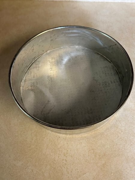 The springform pan greased and lined with a parchment paper liner.