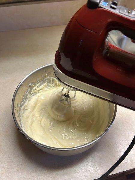 The cream cheese layer of the bars is ready to spread.