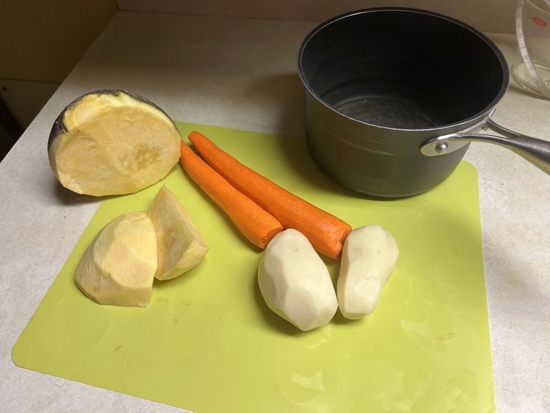 Chopped potatoes, carrots, and rutabaga ready for boiling