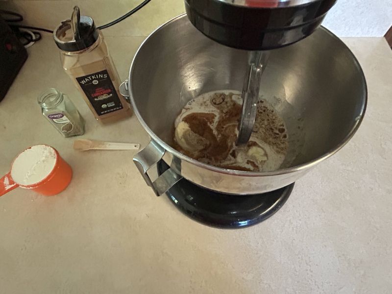 Adding sugar and spices to Skolebrod dough