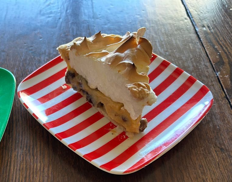 Baked sour cream raisin pie with golden meringue, ready to serve as a classic Norwegian-American Christmas dessert