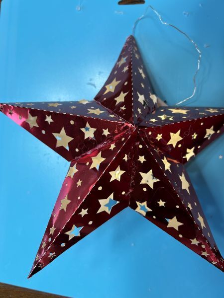 Finished Scandinavian-style paper star tree topper ready for the tree.