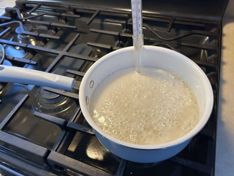 Boiling sugar syrup for strawberry divinity