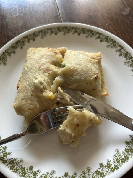 Handheld turkey pot pie lefse pocket ready to eat.