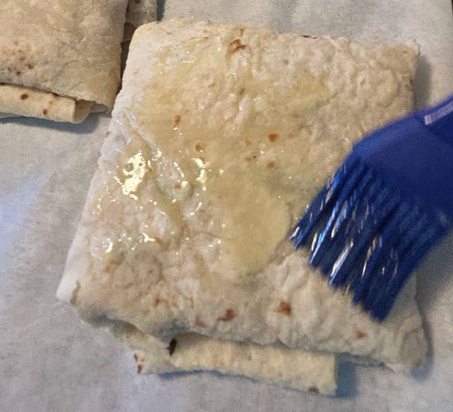 Lefse folded into a pocket before baking.